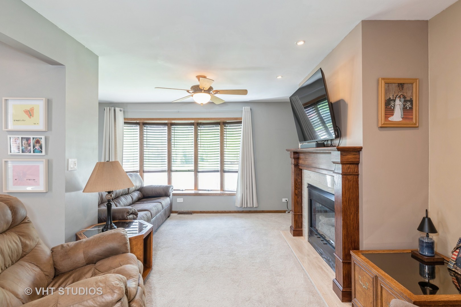 1438 Ridge Road Homewood, IL 60430 - Photo 5 of 35 a living room with furniture a fireplace and a flat screen tv