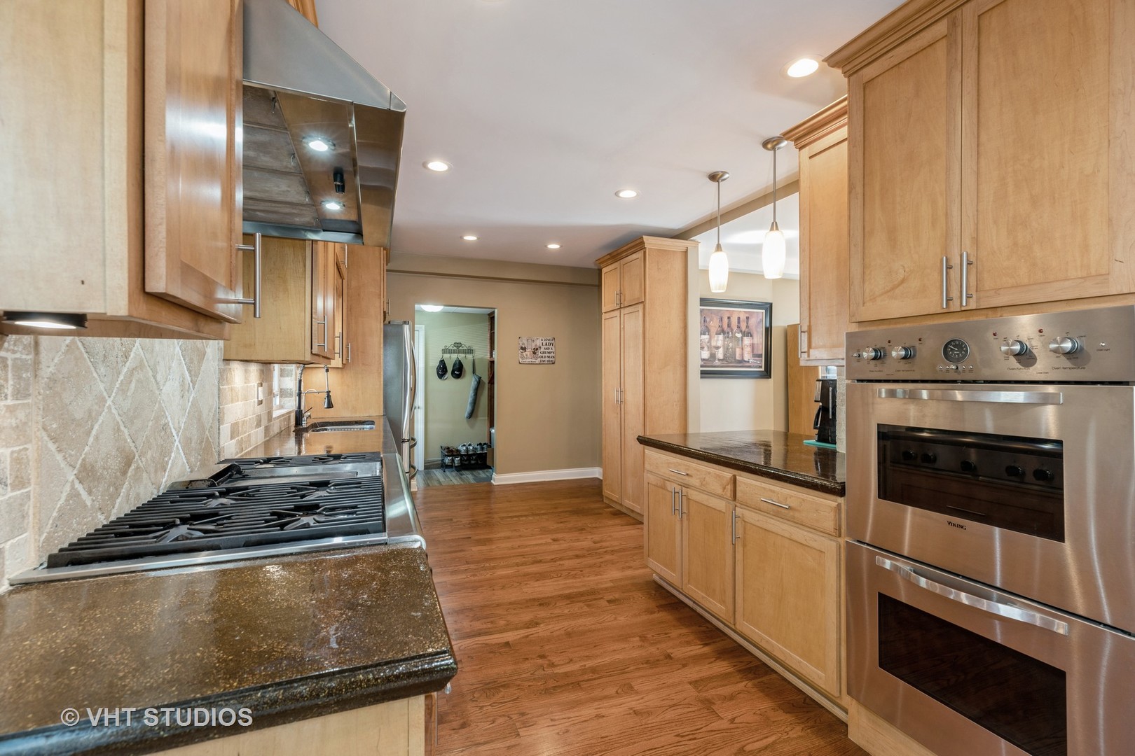 1438 Ridge Road Homewood, IL 60430 - Photo 8 of 35 a kitchen with stainless steel appliances granite countertop a stove and a refrigerator