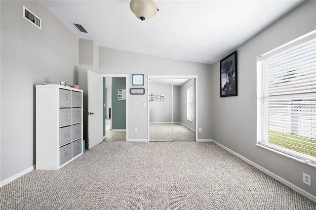 a bathroom with a sink a toilet a mirror and shower