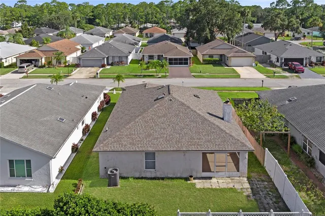 an aerial view of a house with a garden and plants