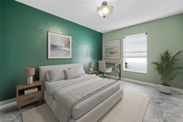 a view of an empty room with window and closet
