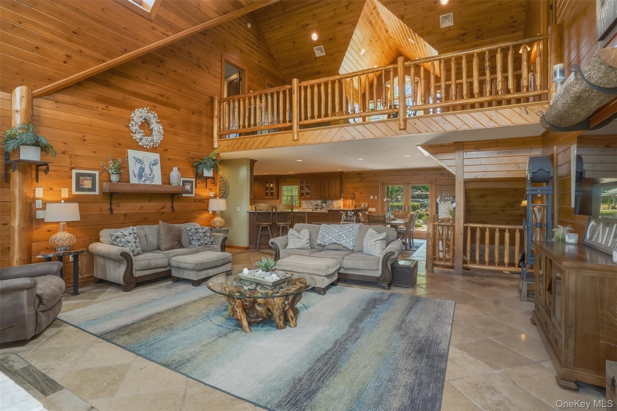 95 Judson Road Montgomery, NY 12549 - Photo 11 of 50 The dramatic great room serves as the heart of the home with floor-to-ceiling windows and a striking stone fireplace.
