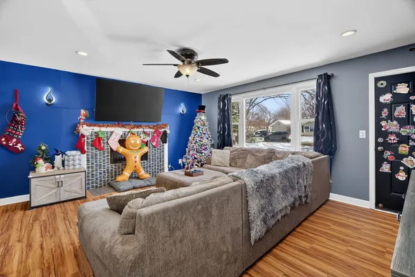 a bedroom with furniture and a wooden floor