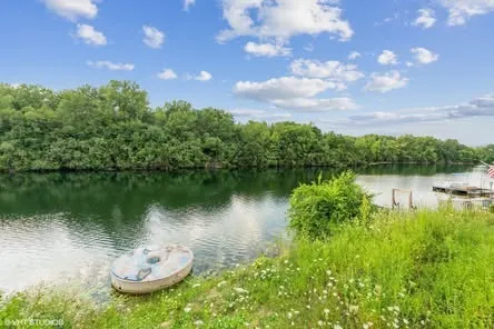 a view of a lake with a house in the background