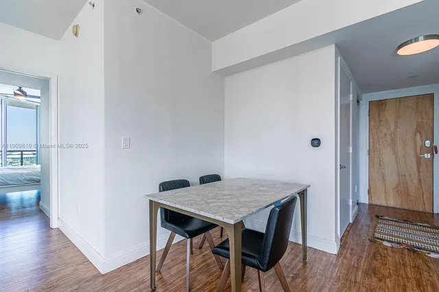 a view of kitchen island with wooden floor
