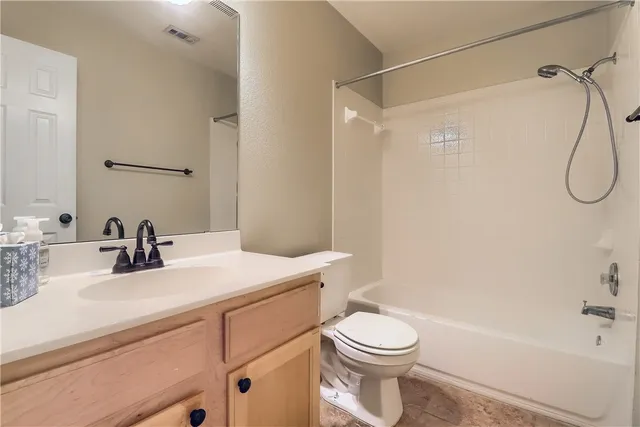 a bathroom with a sink a toilet and a bathtub