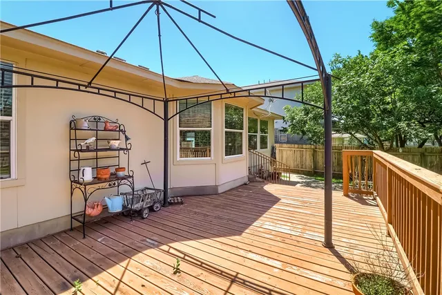 a view of a house with a backyard porch and sitting area
