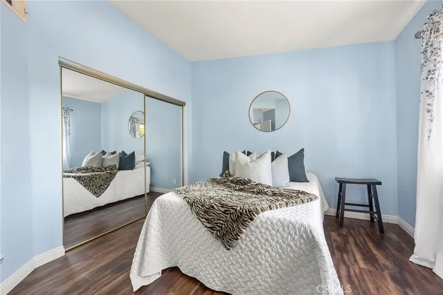 a bedroom with bed and a dresser