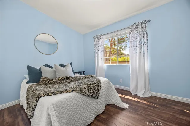 a bedroom with a bed and window