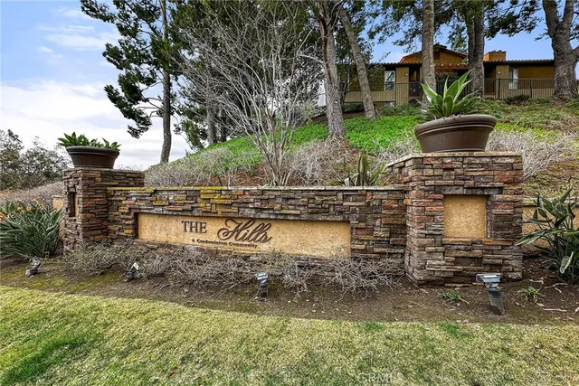 a swimming pool with trees in the background