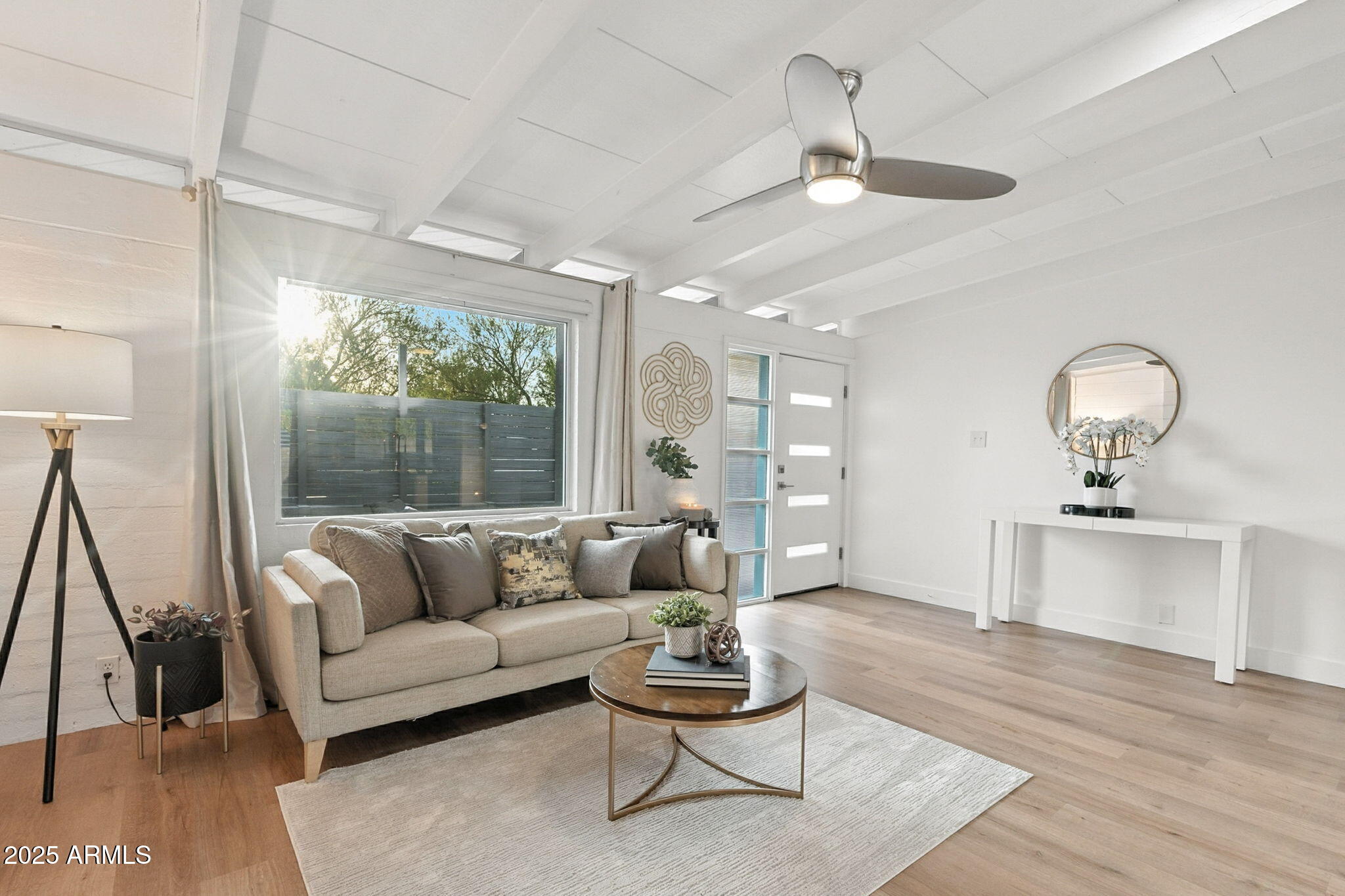 5809 North 10th Place Phoenix, AZ 85014 - Photo 11 of 81 a living room with furniture and a large window