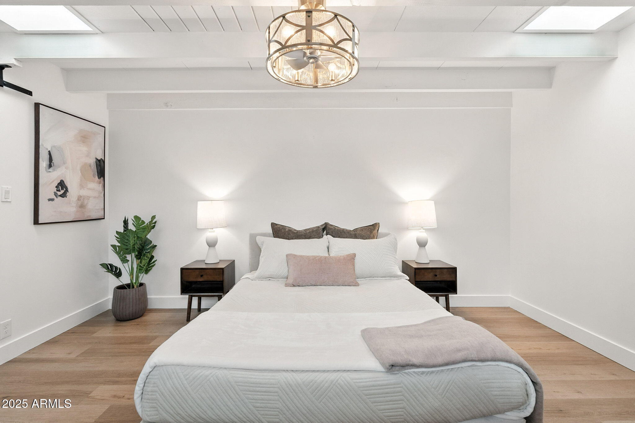 5809 North 10th Place Phoenix, AZ 85014 - Photo 25 of 81 a bedroom with bed and a potted plant