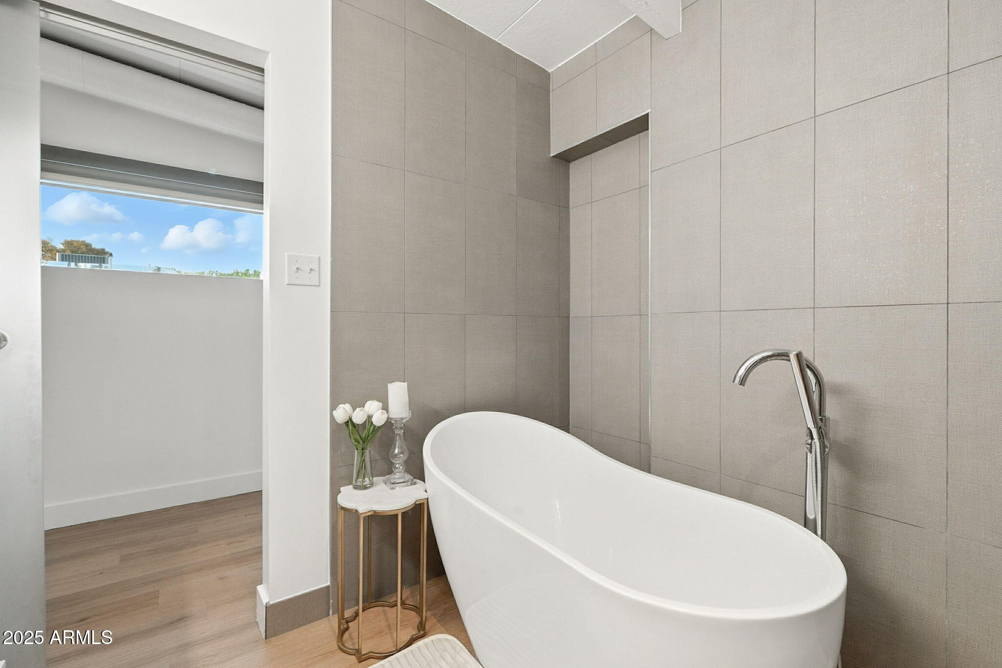 5809 North 10th Place Phoenix, AZ 85014 - Photo 28 of 81 a bathroom with a white bath tub and a shower