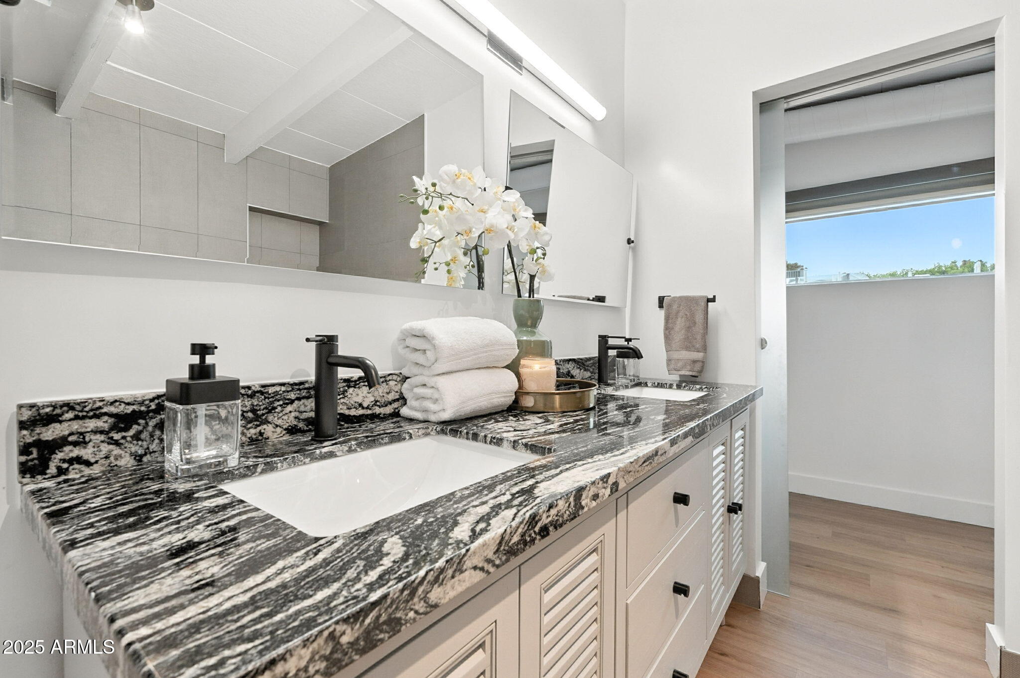5809 North 10th Place Phoenix, AZ 85014 - Photo 29 of 81 a bathroom with sink and mirror