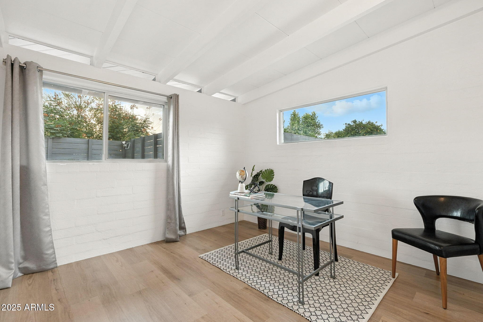 5809 North 10th Place Phoenix, AZ 85014 - Photo 32 of 81 a workspace with furniture and a window