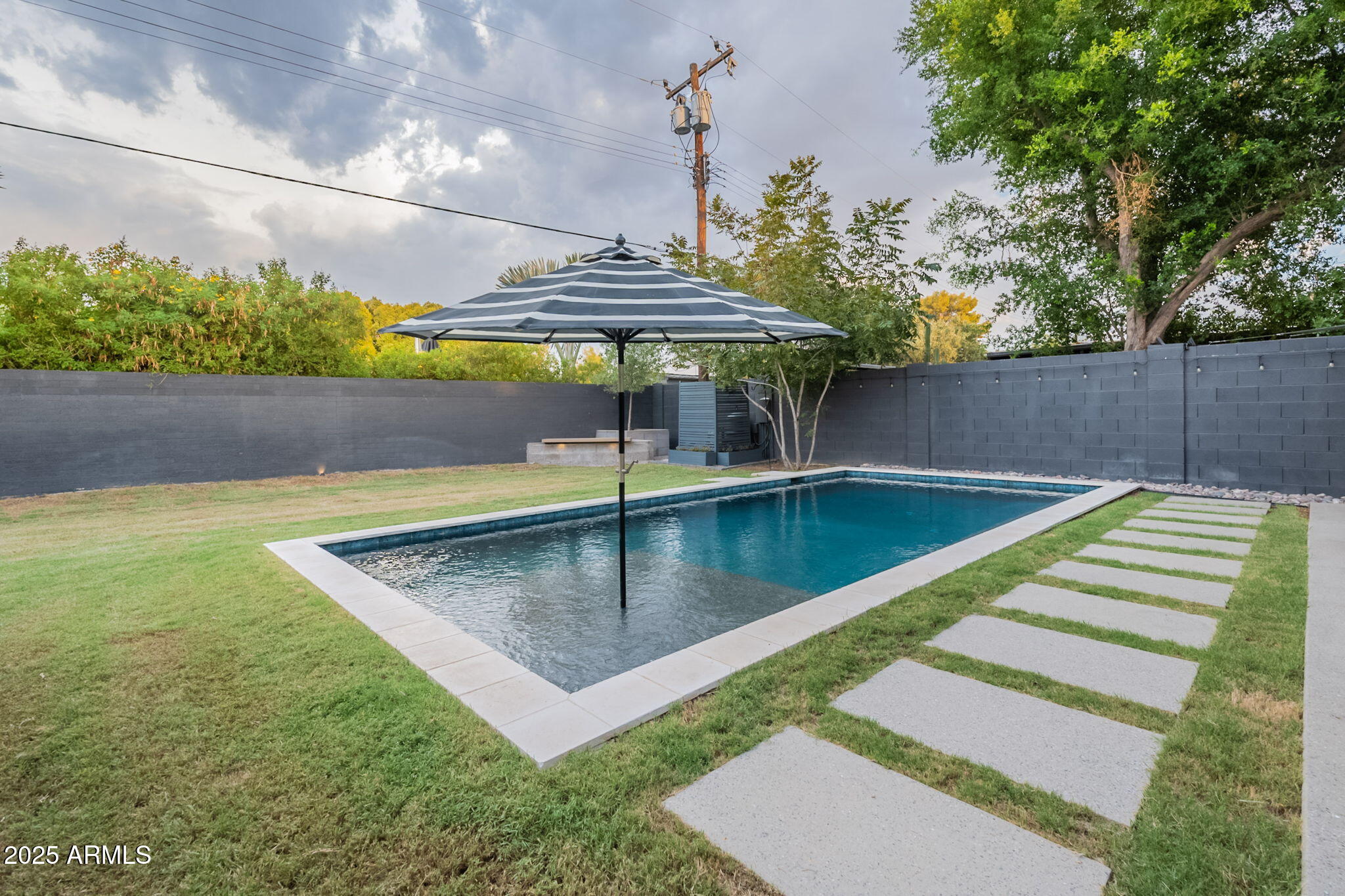 5809 North 10th Place Phoenix, AZ 85014 - Photo 46 of 81 a view of a swimming pool with a patio