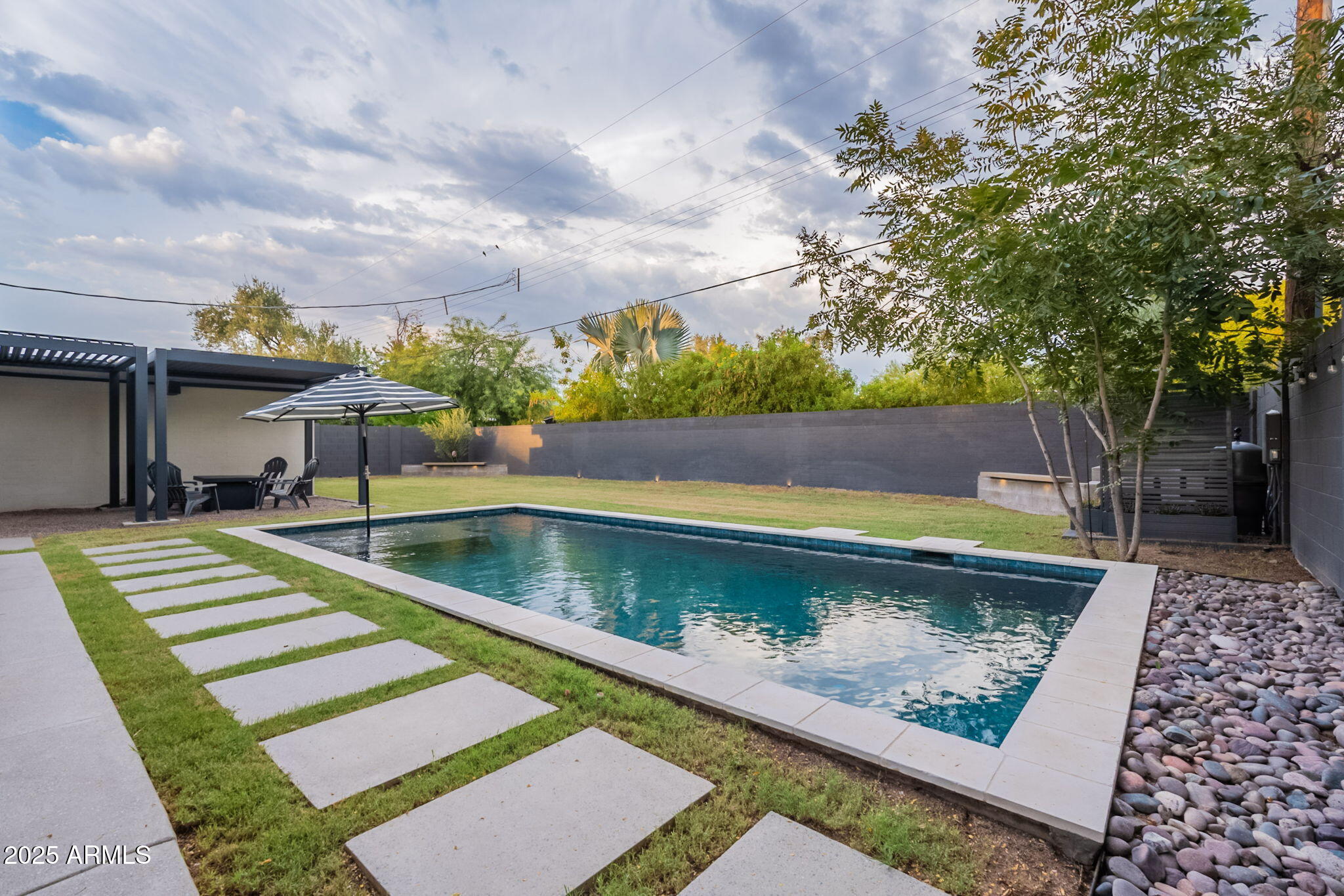 5809 North 10th Place Phoenix, AZ 85014 - Photo 47 of 81 a view of swimming pool with a lounge chairs