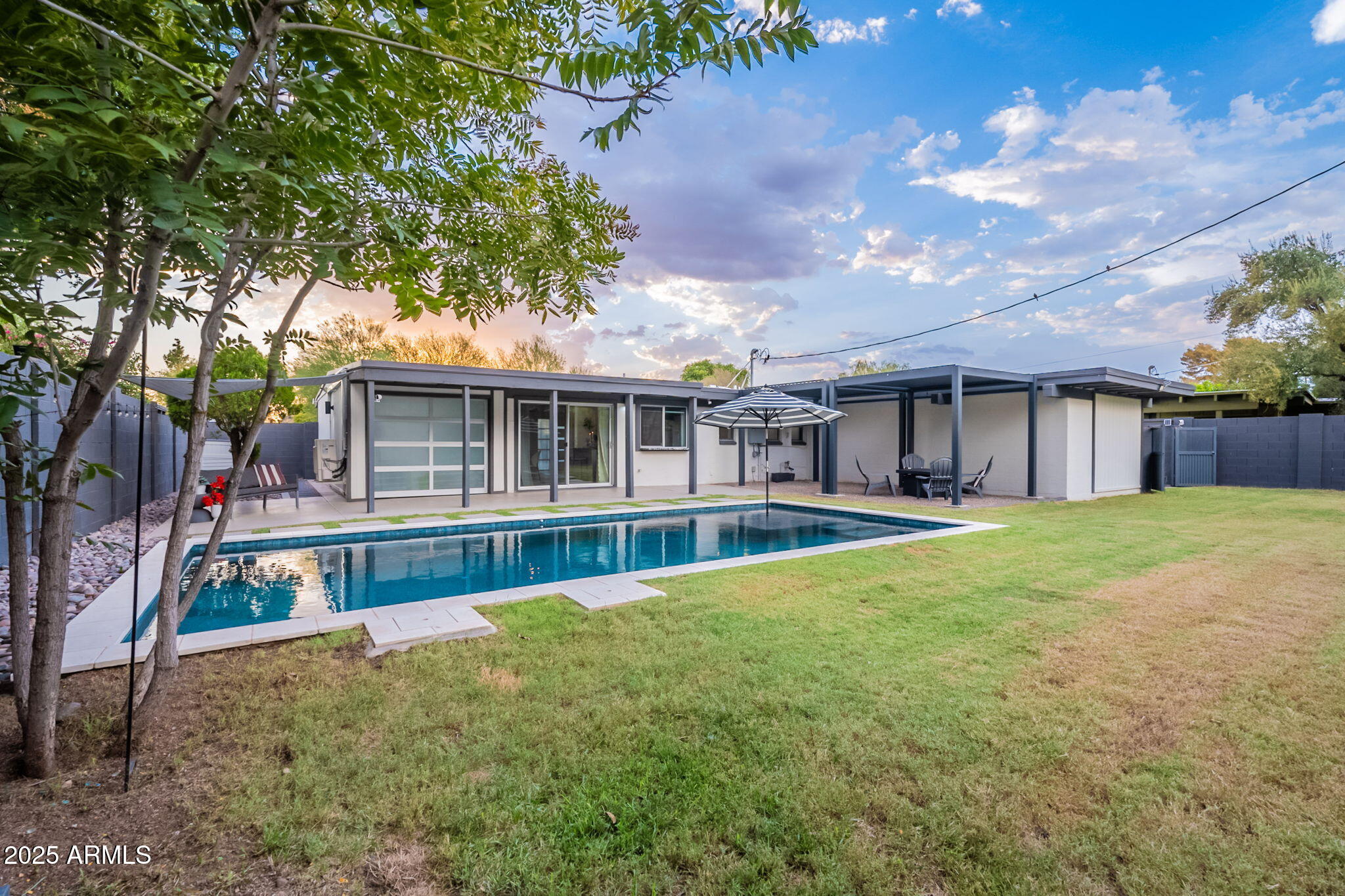 5809 North 10th Place Phoenix, AZ 85014 - Photo 50 of 81 a view of house with outdoor space and swimming pool