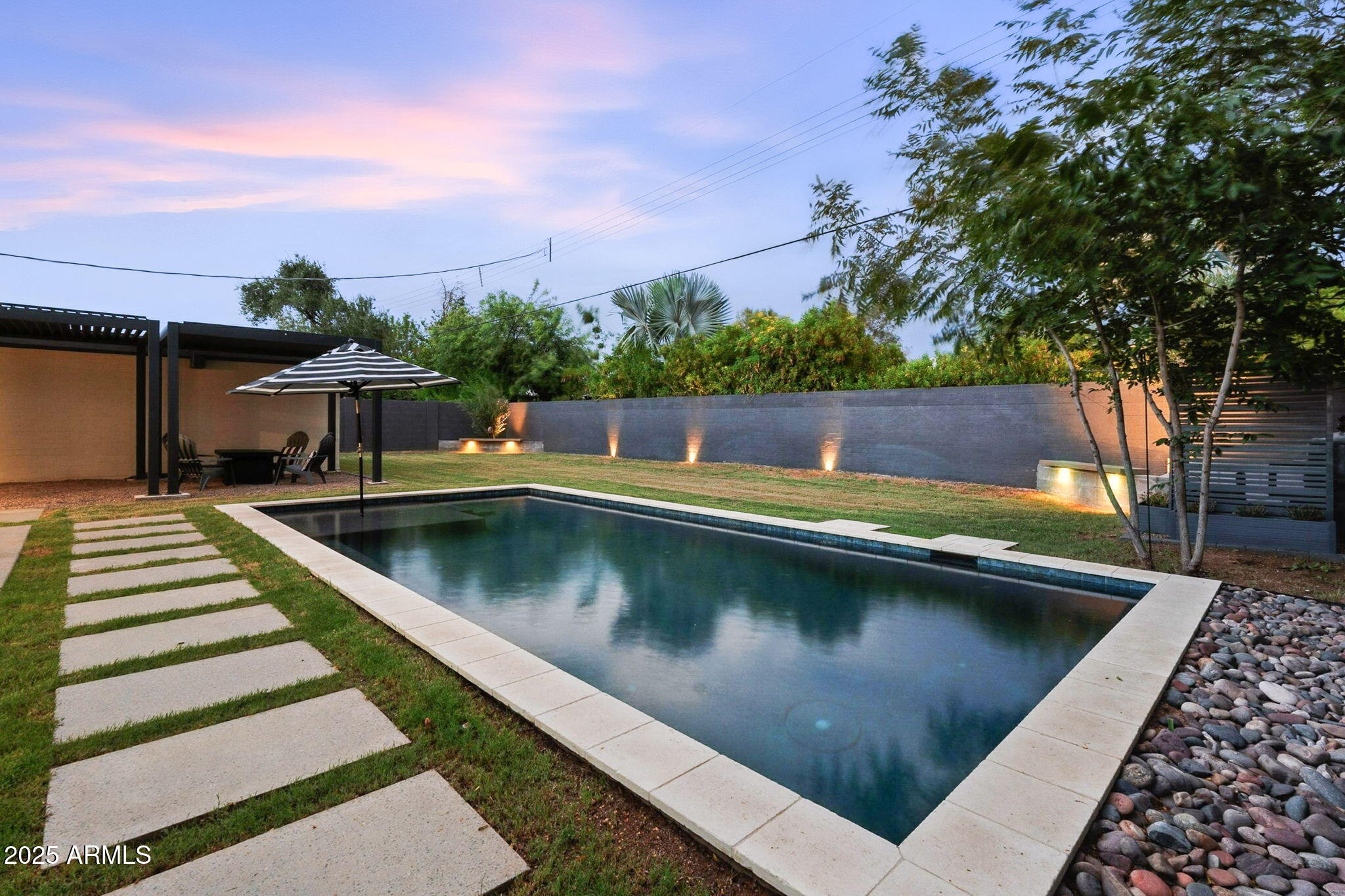 5809 North 10th Place Phoenix, AZ 85014 - Photo 66 of 81 a view of swimming pool with a lounge chairs
