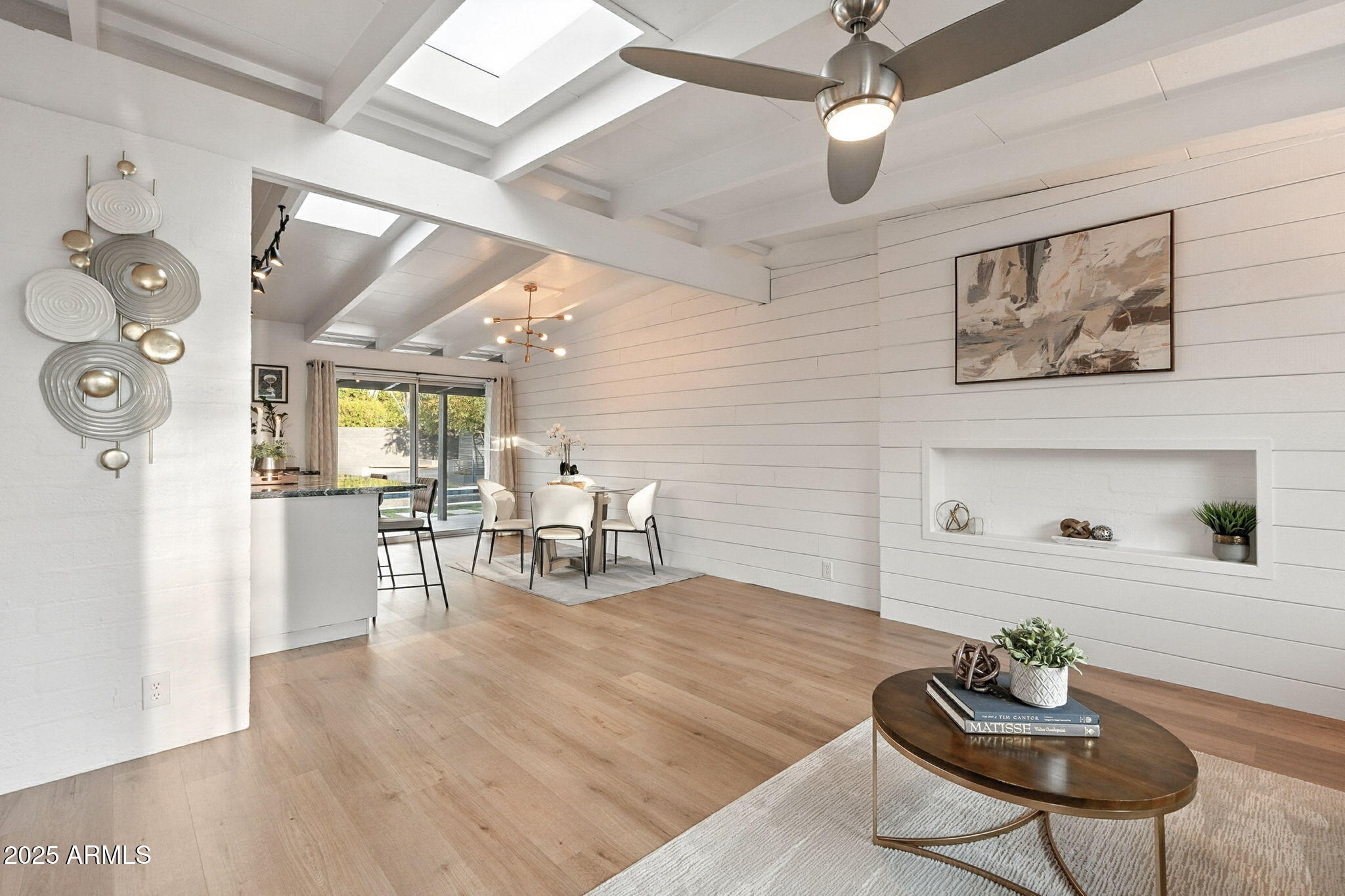 5809 North 10th Place Phoenix, AZ 85014 - Photo 10 of 81 a living room with furniture and a wooden floor