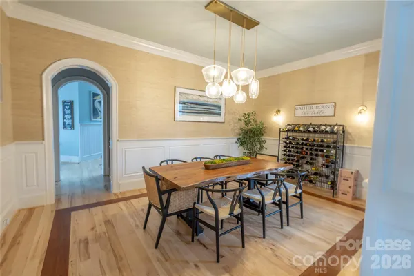 a bathroom with a sink a toilet a shower curtain and a bath tub