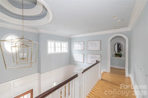 a living room with furniture a large window and a fireplace