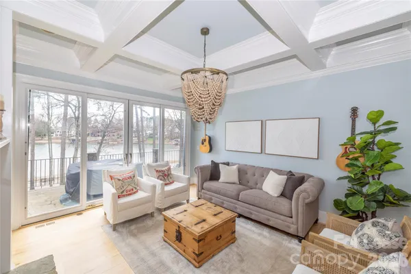 a bedroom with furniture and a large window