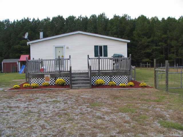 6015 Applewhite Road Wendell, NC 27591 - Photo 5 of 10 Side entrance of home with deck