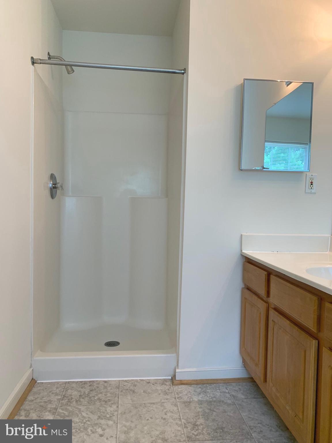 208 Torbert Loop Stafford, VA 22554 - Photo 11 of 16 a bathroom with a shower