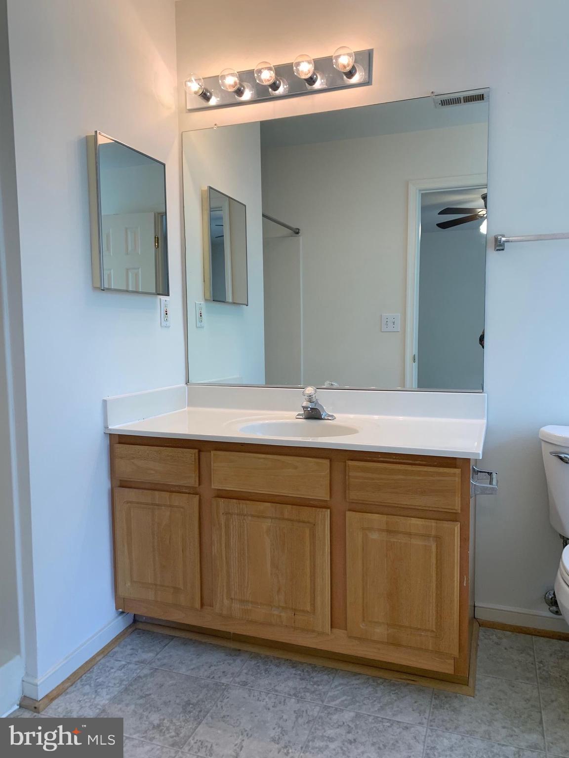 208 Torbert Loop Stafford, VA 22554 - Photo 12 of 16 a bathroom with a double vanity sink and mirror