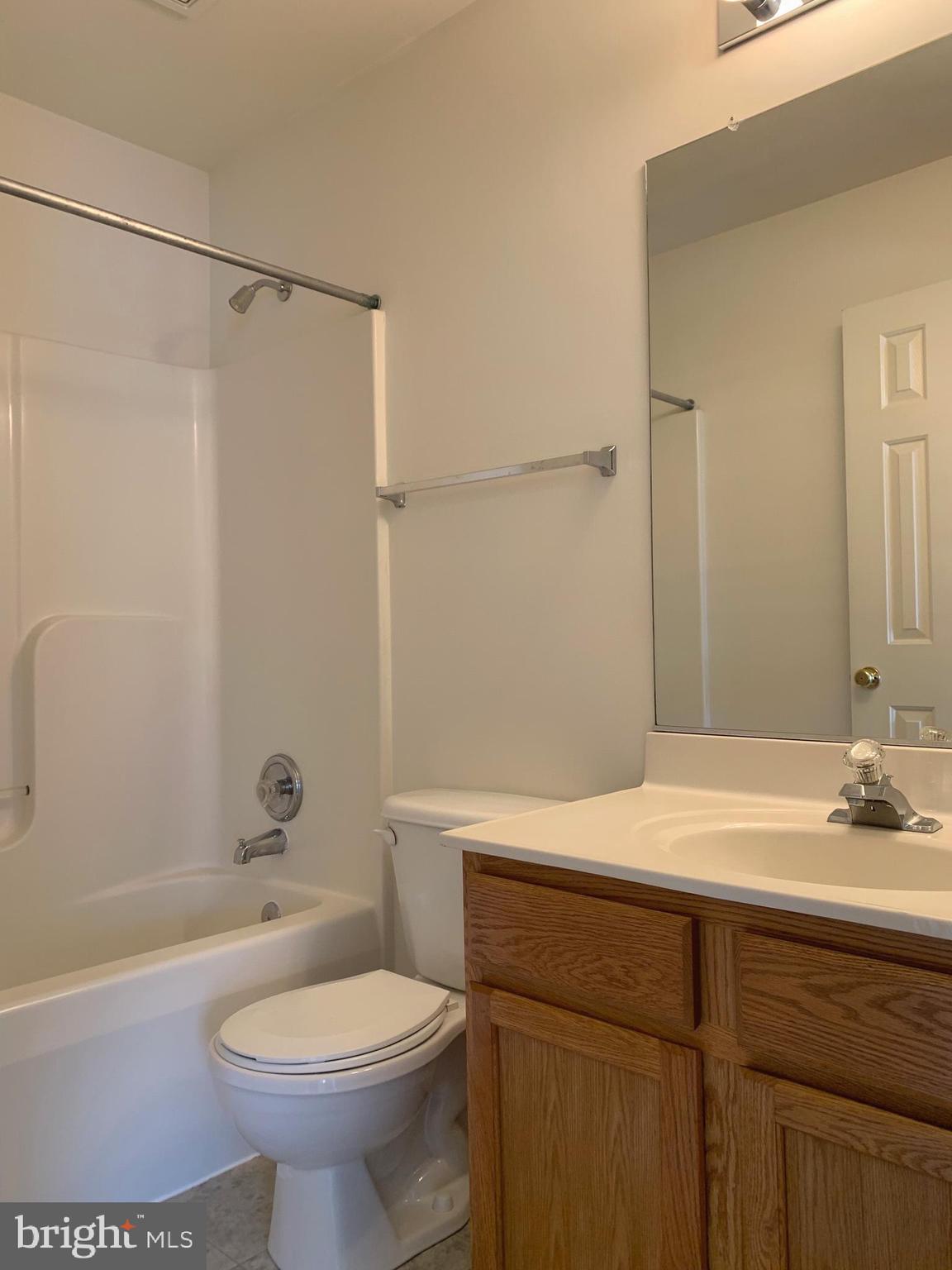 208 Torbert Loop Stafford, VA 22554 - Photo 15 of 16 a bathroom with a sink toilet and shower