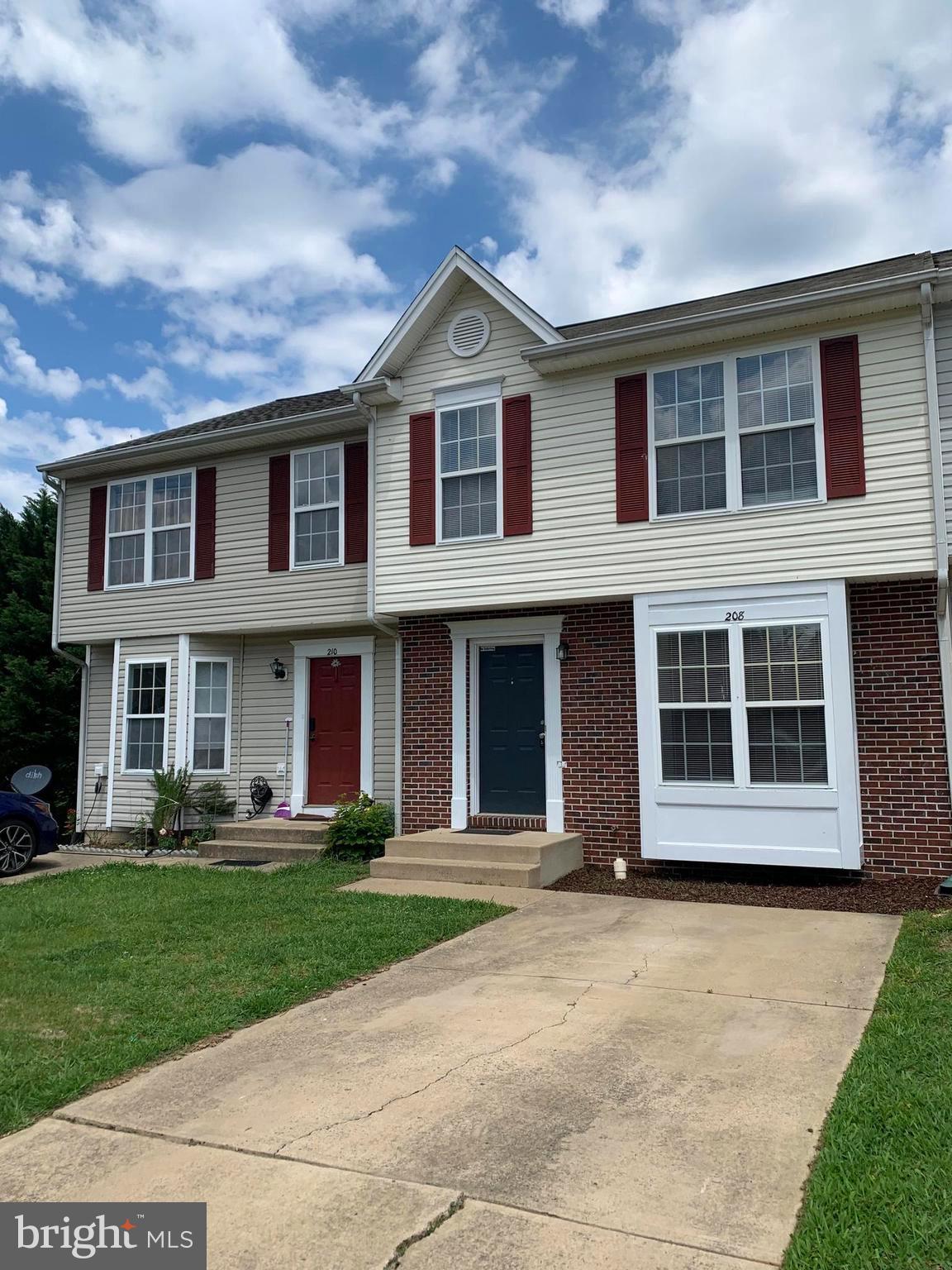 208 Torbert Loop Stafford, VA 22554 - Photo 2 of 16 a front view of a house with a yard
