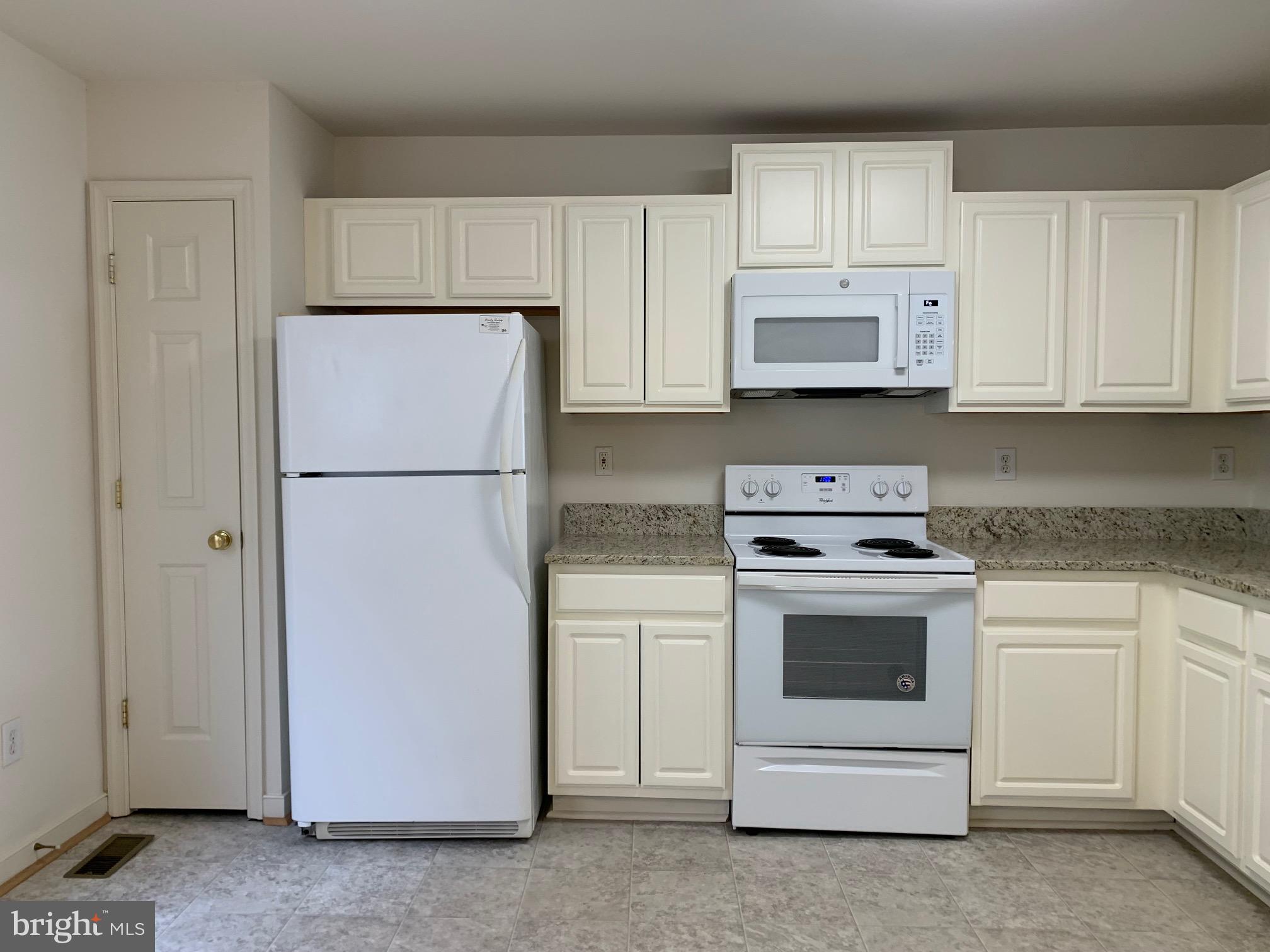 208 Torbert Loop Stafford, VA 22554 - Photo 4 of 16 a kitchen with cabinets stainless steel appliances and a counter space