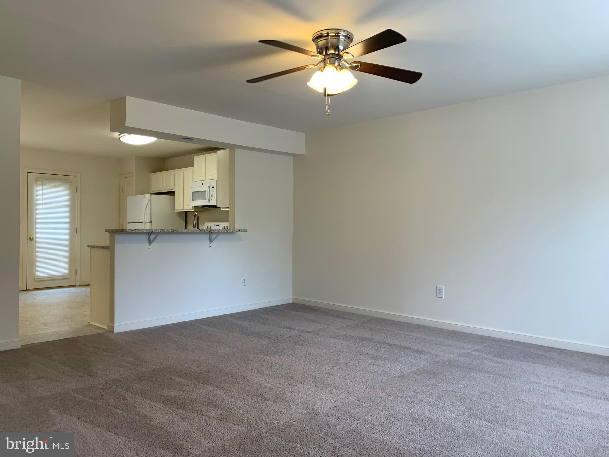 208 Torbert Loop Stafford, VA 22554 - Photo 7 of 16 a view of a kitchen with a sink and a chandelier fan