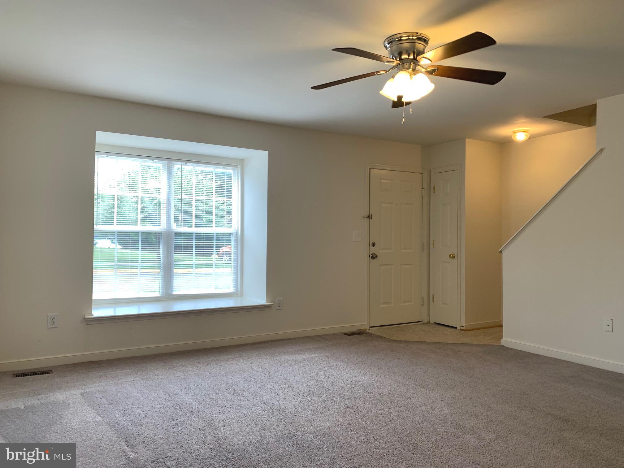 208 Torbert Loop Stafford, VA 22554 - Photo 8 of 16 a view of an empty room with a window