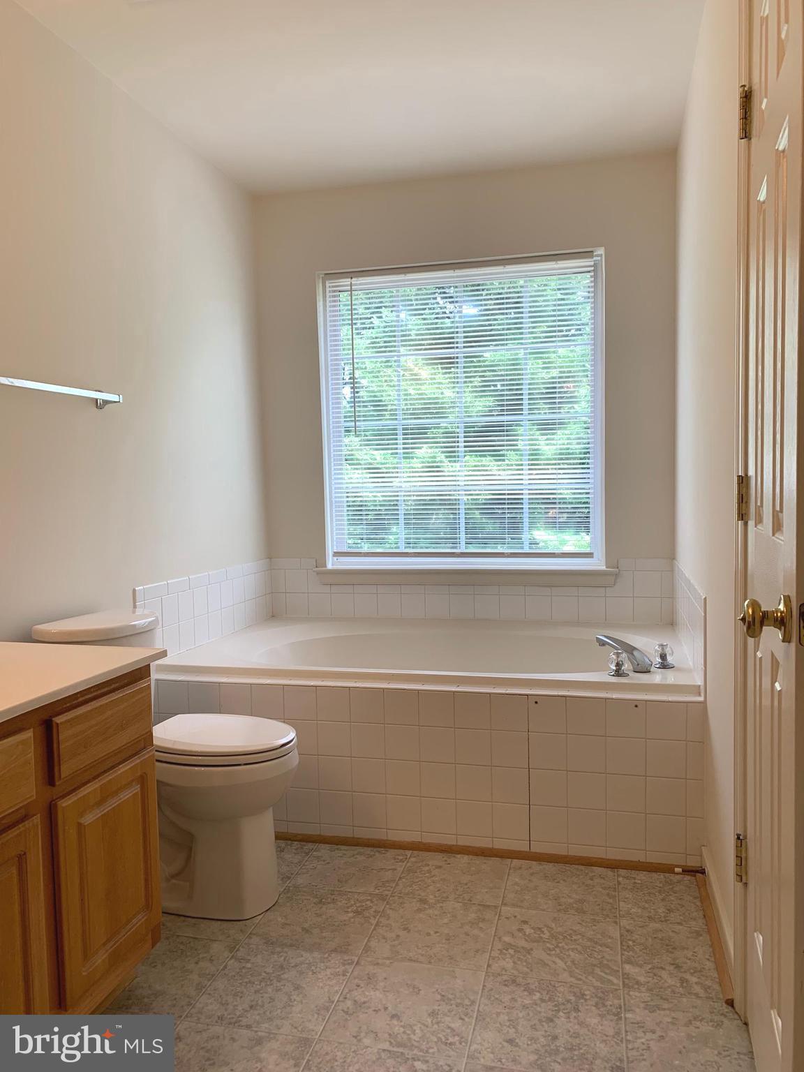208 Torbert Loop Stafford, VA 22554 - Photo 10 of 16 a bathroom with a toilet a sink and bathtub