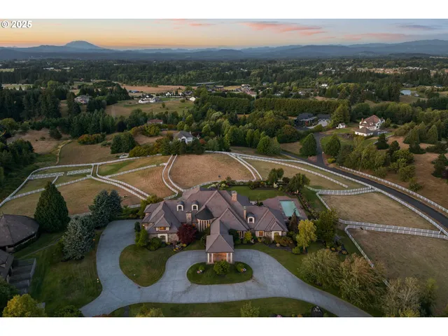 an aerial view of residential house with outdoor space and mountain view