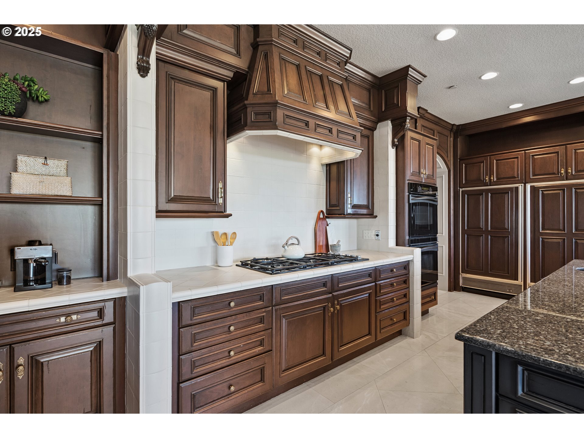 21121 Northwest 17th Court Ridgefield, WA 98642 - Photo 14 of 48 a kitchen with a sink stove and cabinets