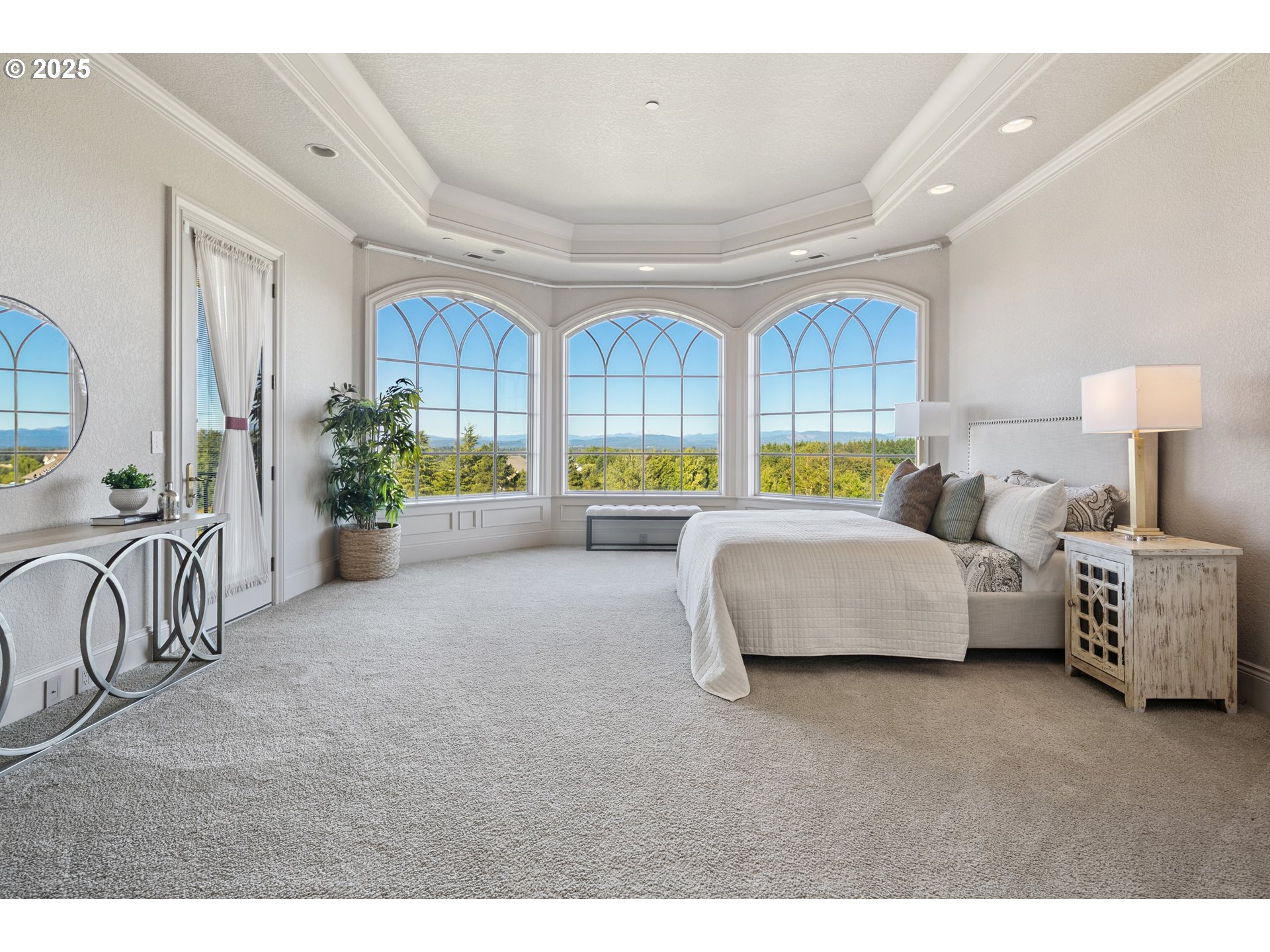 21121 Northwest 17th Court Ridgefield, WA 98642 - Photo 24 of 48 a spacious bedroom with a bed and a couch