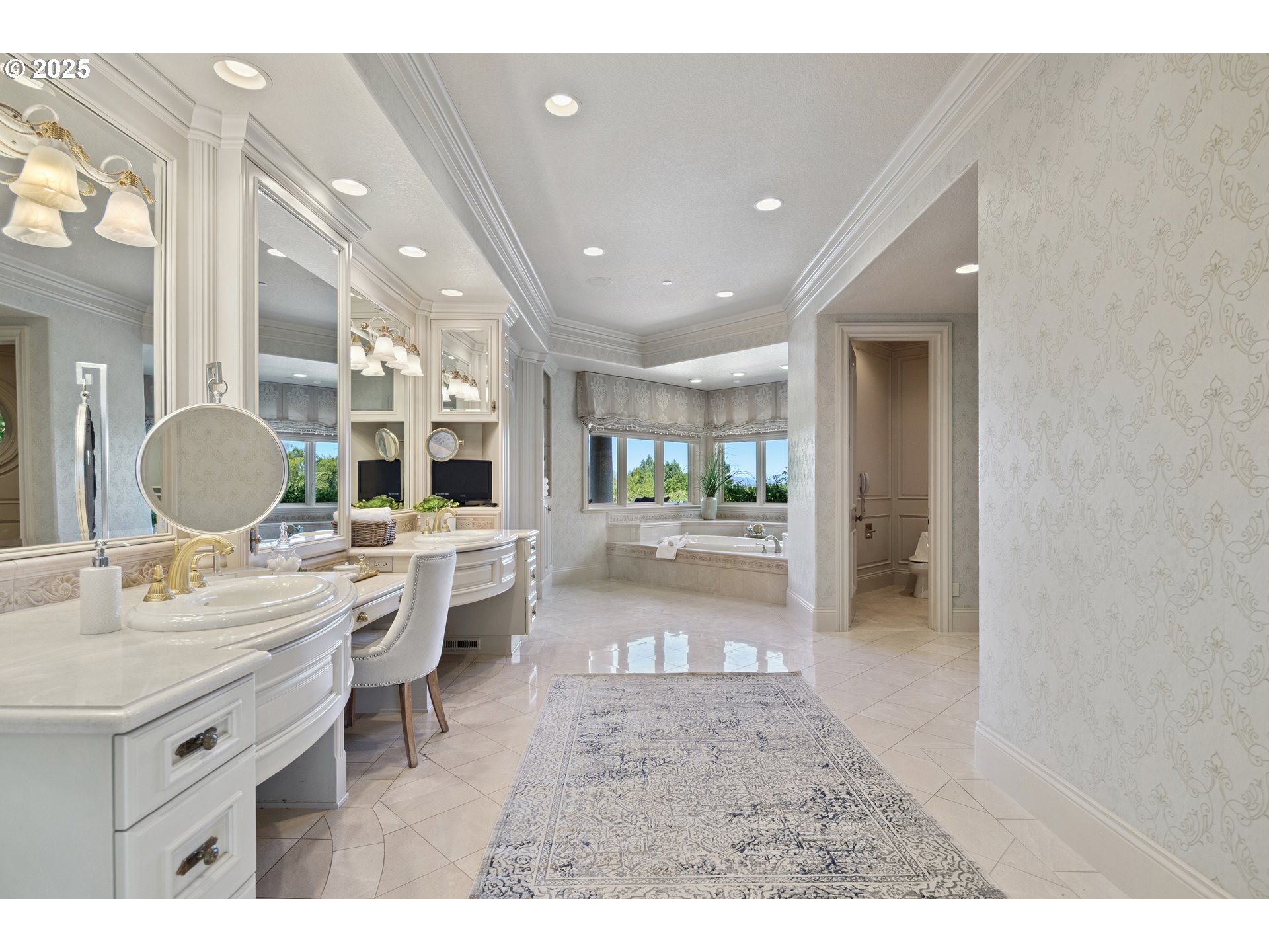 21121 Northwest 17th Court Ridgefield, WA 98642 - Photo 25 of 48 a large bathroom with a sink mirror and a bath tub