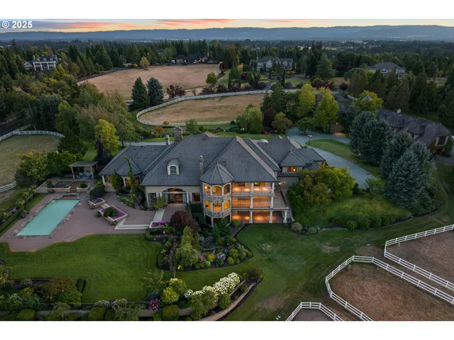 an aerial view of a house with garden space and outdoor seating
