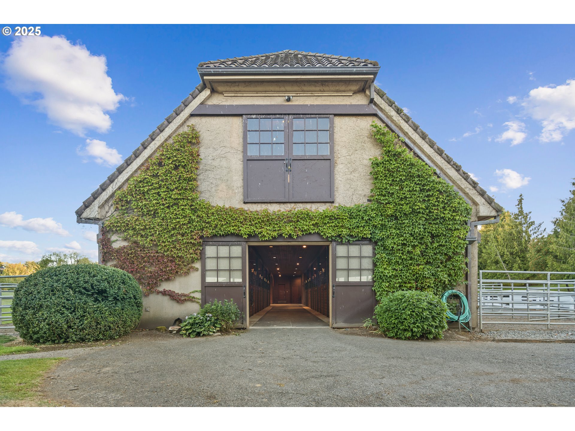 21121 Northwest 17th Court Ridgefield, WA 98642 - Photo 33 of 48 a front view of a house with a garden
