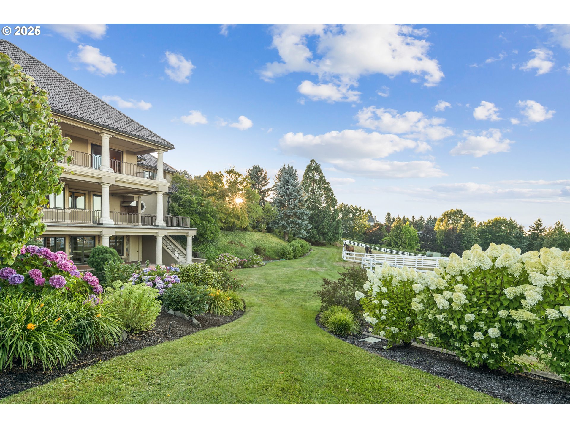 21121 Northwest 17th Court Ridgefield, WA 98642 - Photo 40 of 48 a view of a garden with a lake