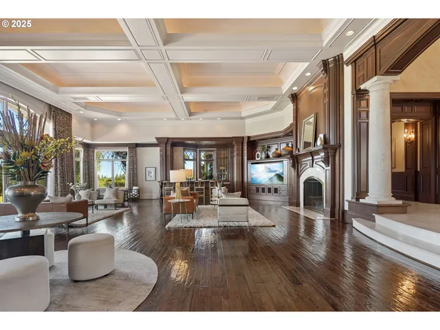 a living room with fireplace furniture and a wooden floor
