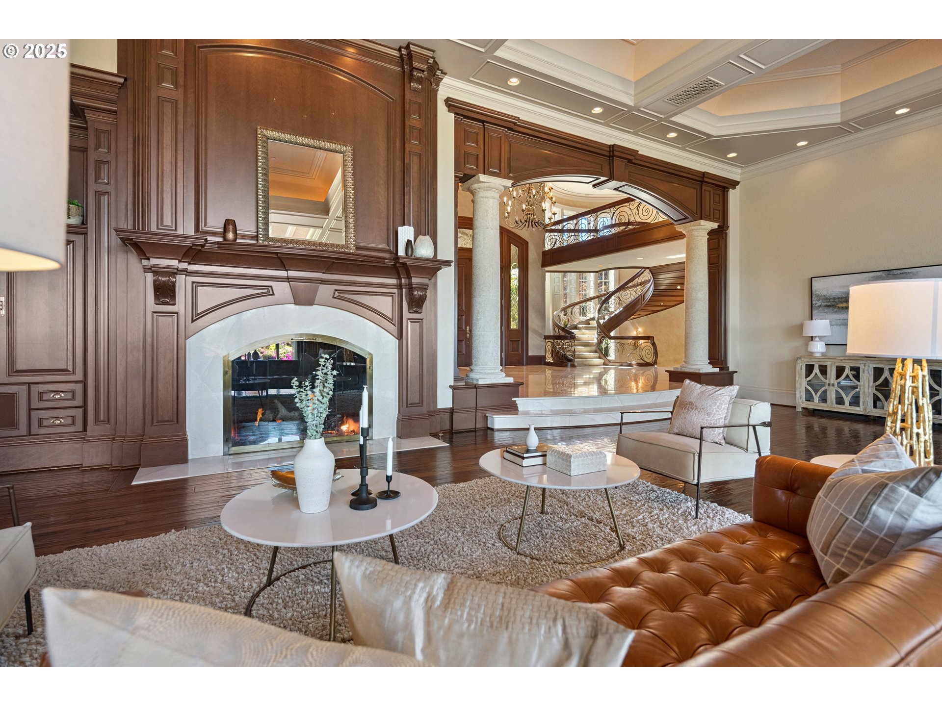 21121 Northwest 17th Court Ridgefield, WA 98642 - Photo 9 of 48 a living room with furniture a fireplace and a table