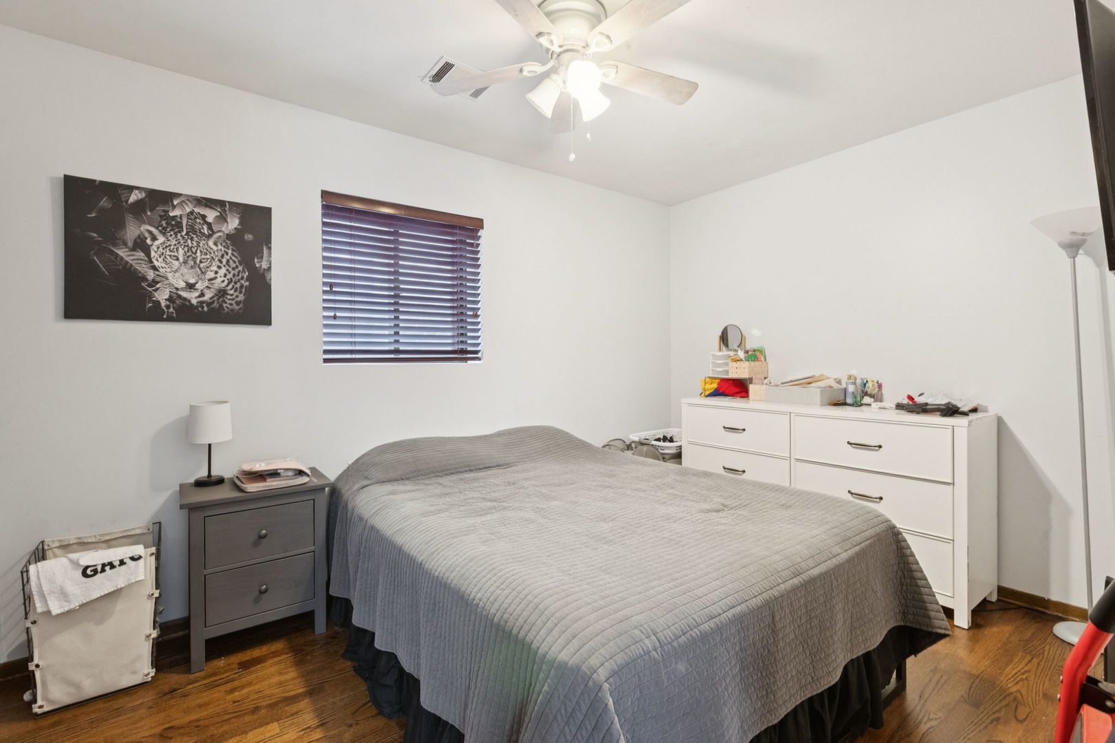 3234 South Princeton Avenue Chicago, IL 60616 - Photo 14 of 56 a bedroom with a bed and a chandelier