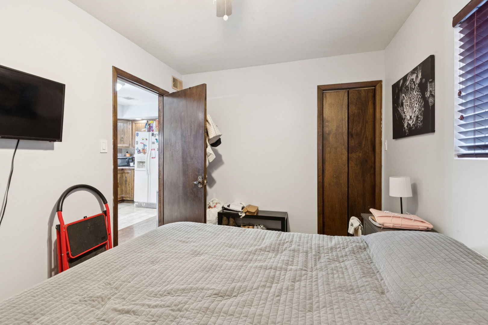 3234 South Princeton Avenue Chicago, IL 60616 - Photo 15 of 56 a bedroom with a bed and a flat screen tv