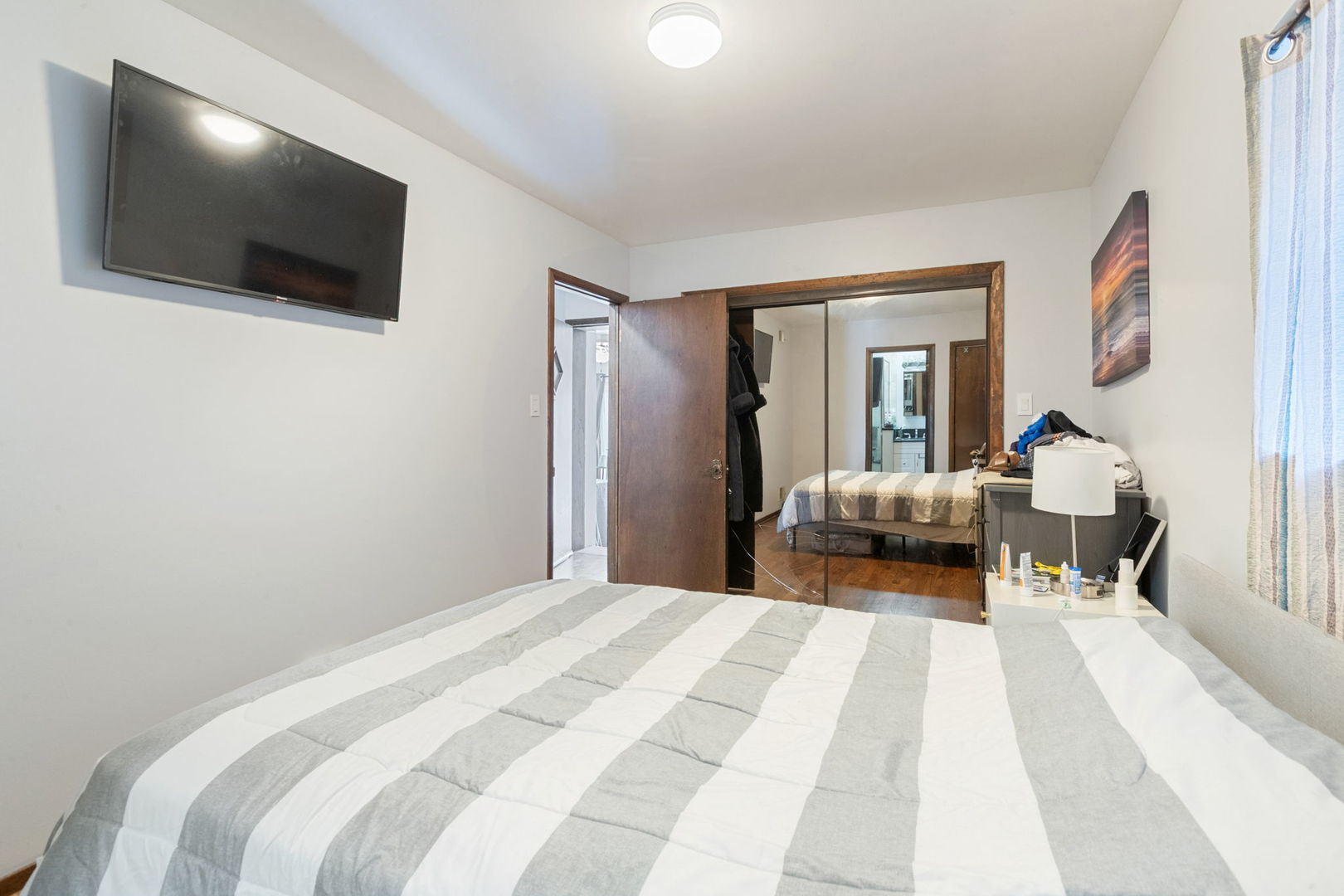 3234 South Princeton Avenue Chicago, IL 60616 - Photo 21 of 56 a bedroom with a bed and a flat screen tv