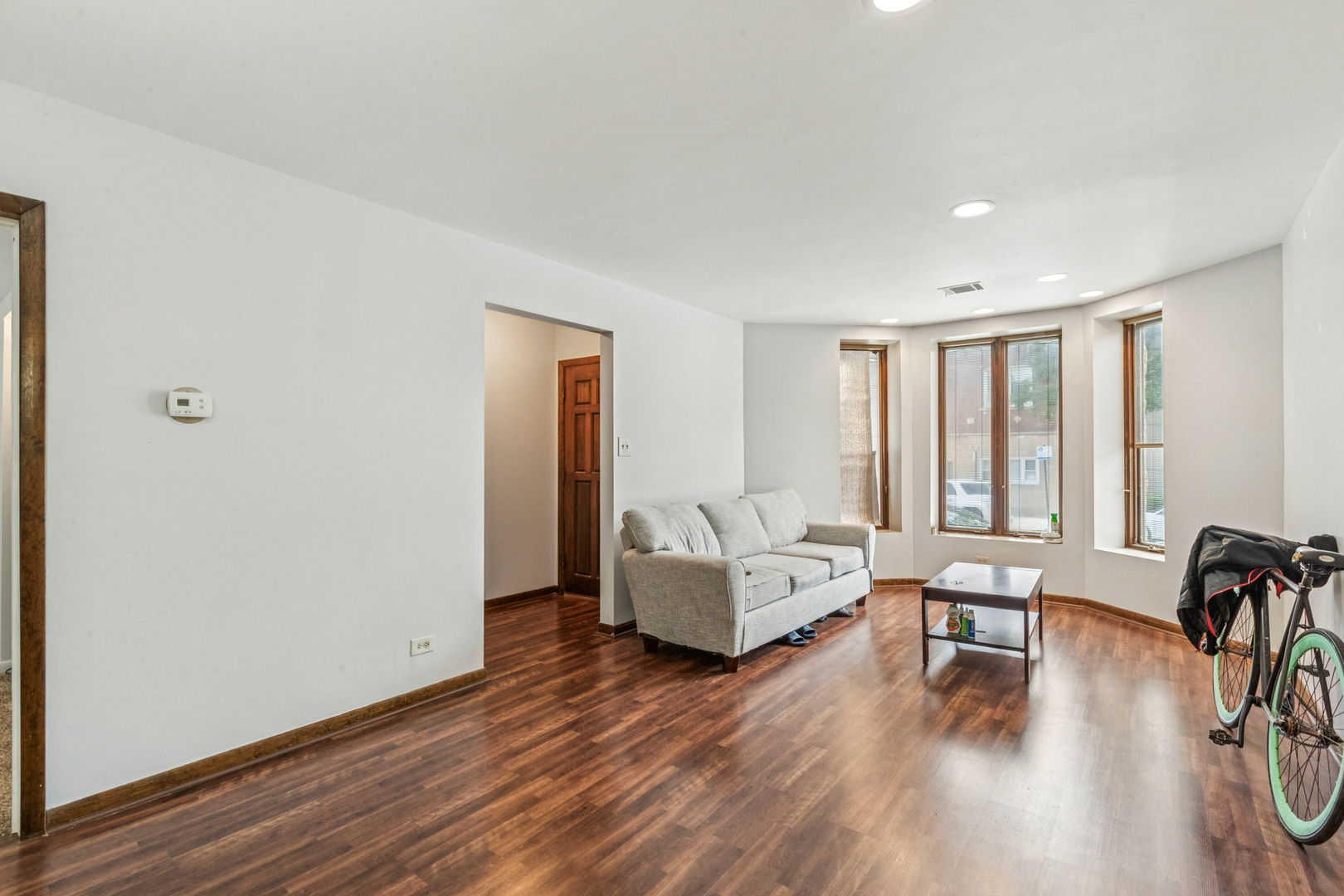 3234 South Princeton Avenue Chicago, IL 60616 - Photo 30 of 56 a living room with furniture and a wooden floor