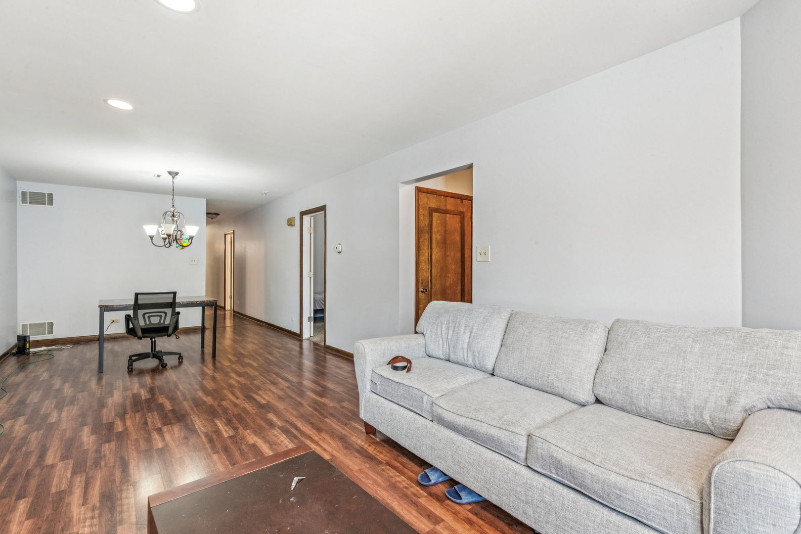 3234 South Princeton Avenue Chicago, IL 60616 - Photo 34 of 56 a living room with furniture and a table